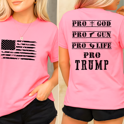 Pink t-shirt with American flag design on front and 'PRO GOD PRO GUN PRO LIFE PRO TRUMP' text on back.