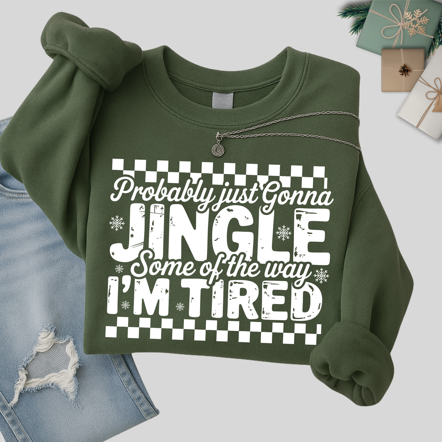 Green sweatshirt folded with holiday design