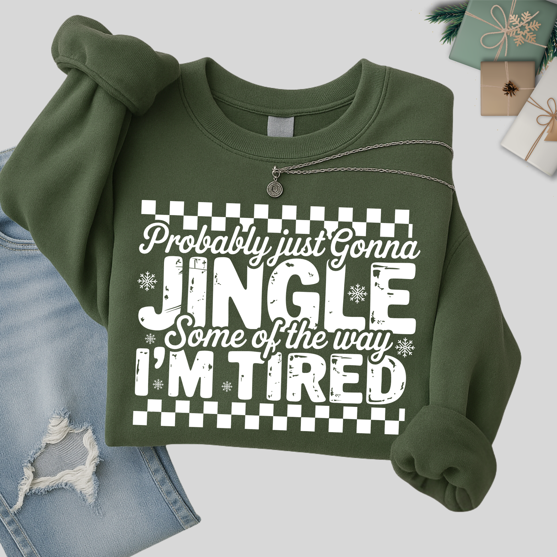 Green sweatshirt folded with holiday design