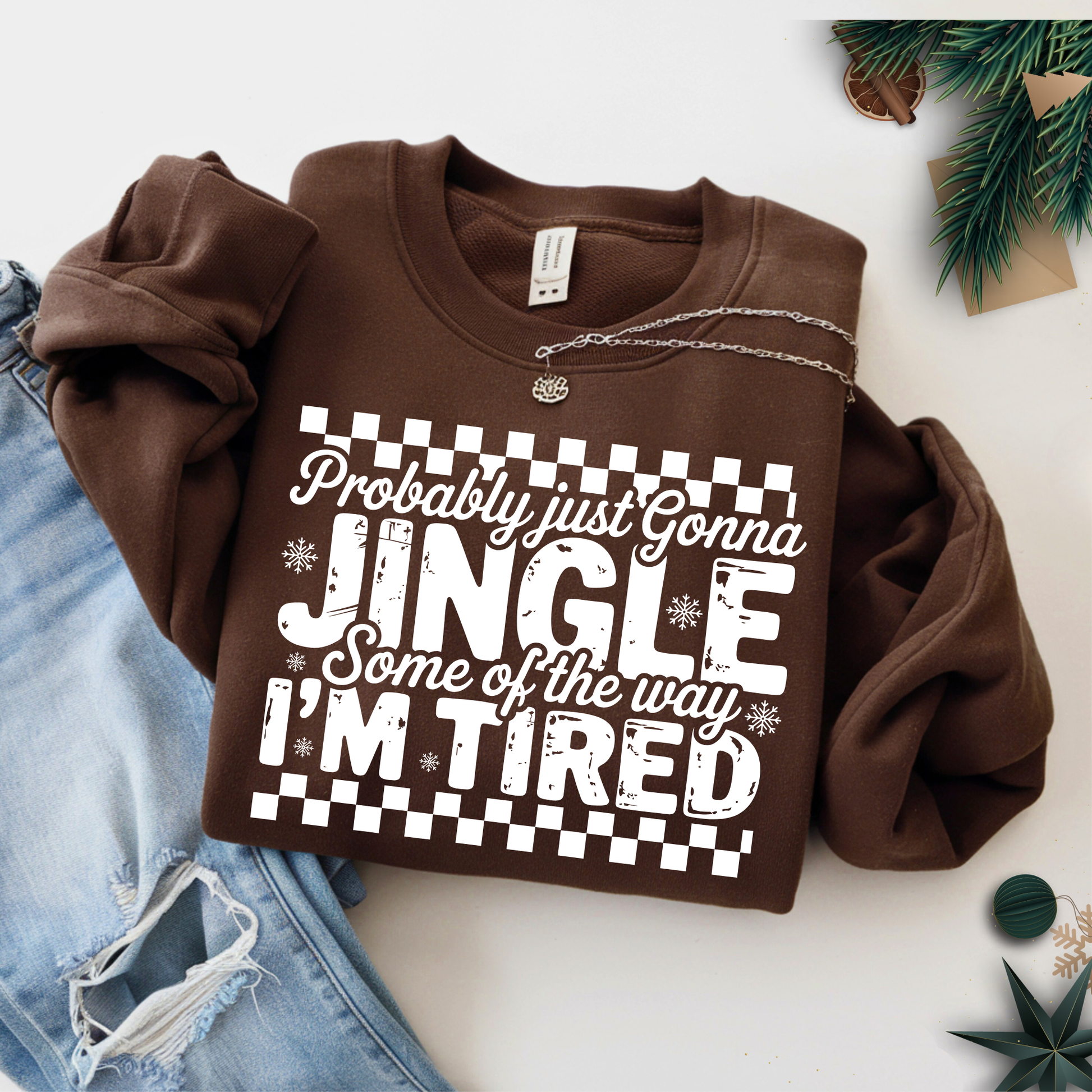 Brown sweatshirt with holiday saying flat lay