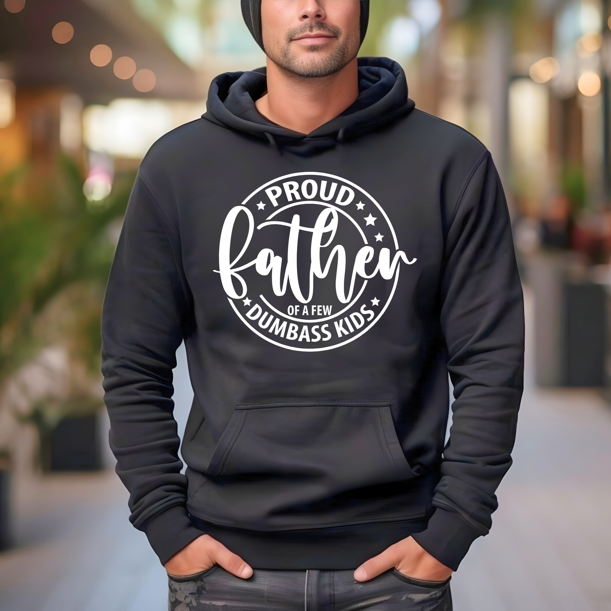 Person wearing a Funny Fathers  black hoodie with white text in an outdoor setting