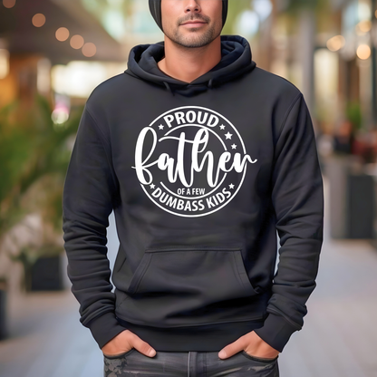 Person wearing a Funny Fathers  black hoodie with white text in an outdoor setting