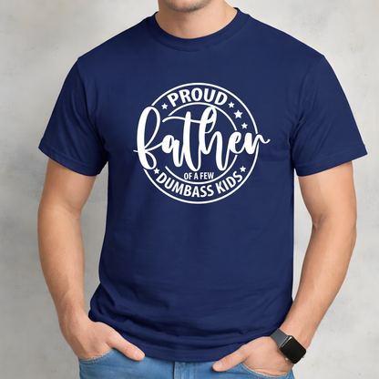 Navy blue t-shirt with white text 'Proud father of a few dumbass kids' worn by a person on a light gray background