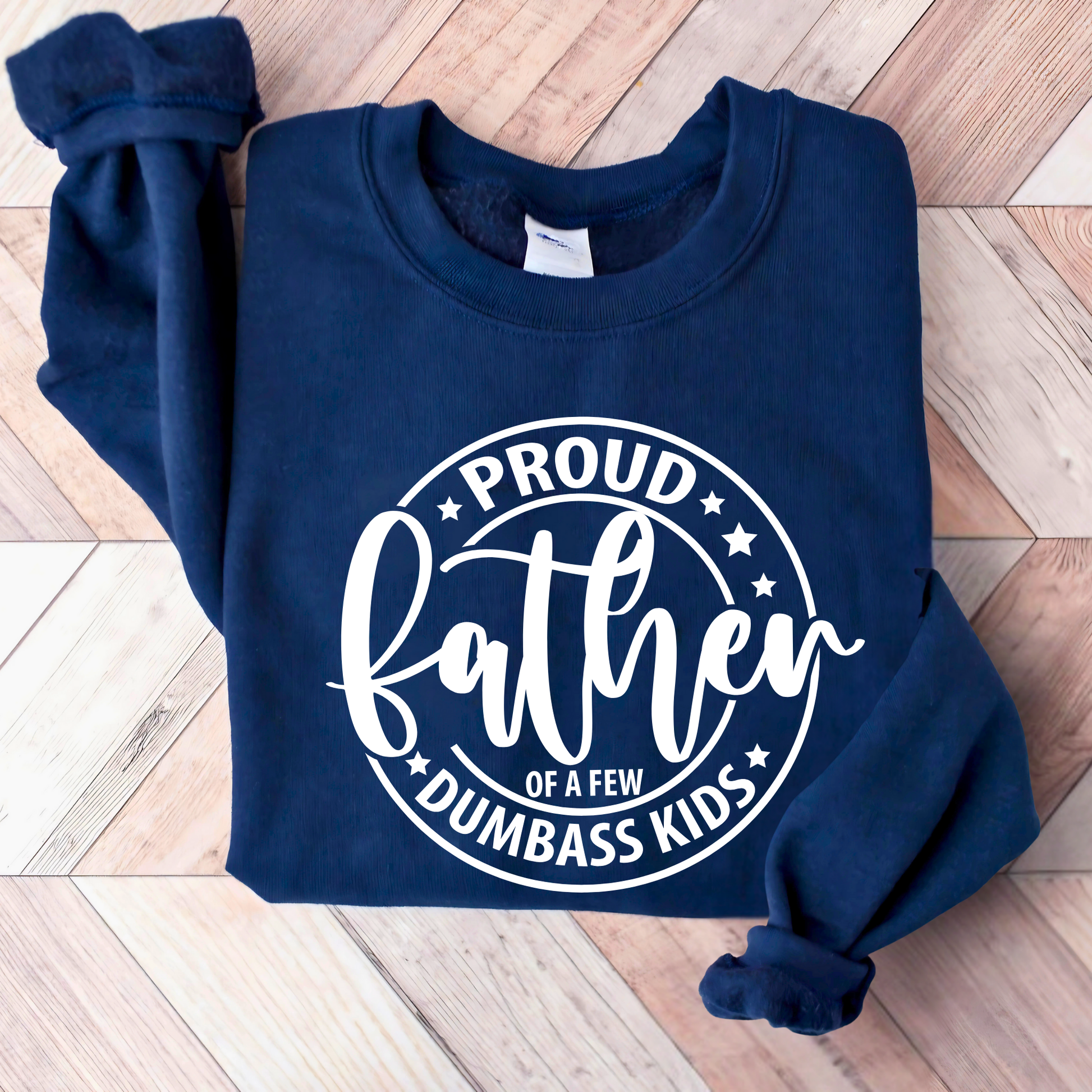 Navy blue sweatshirt with white text on a wooden floor
