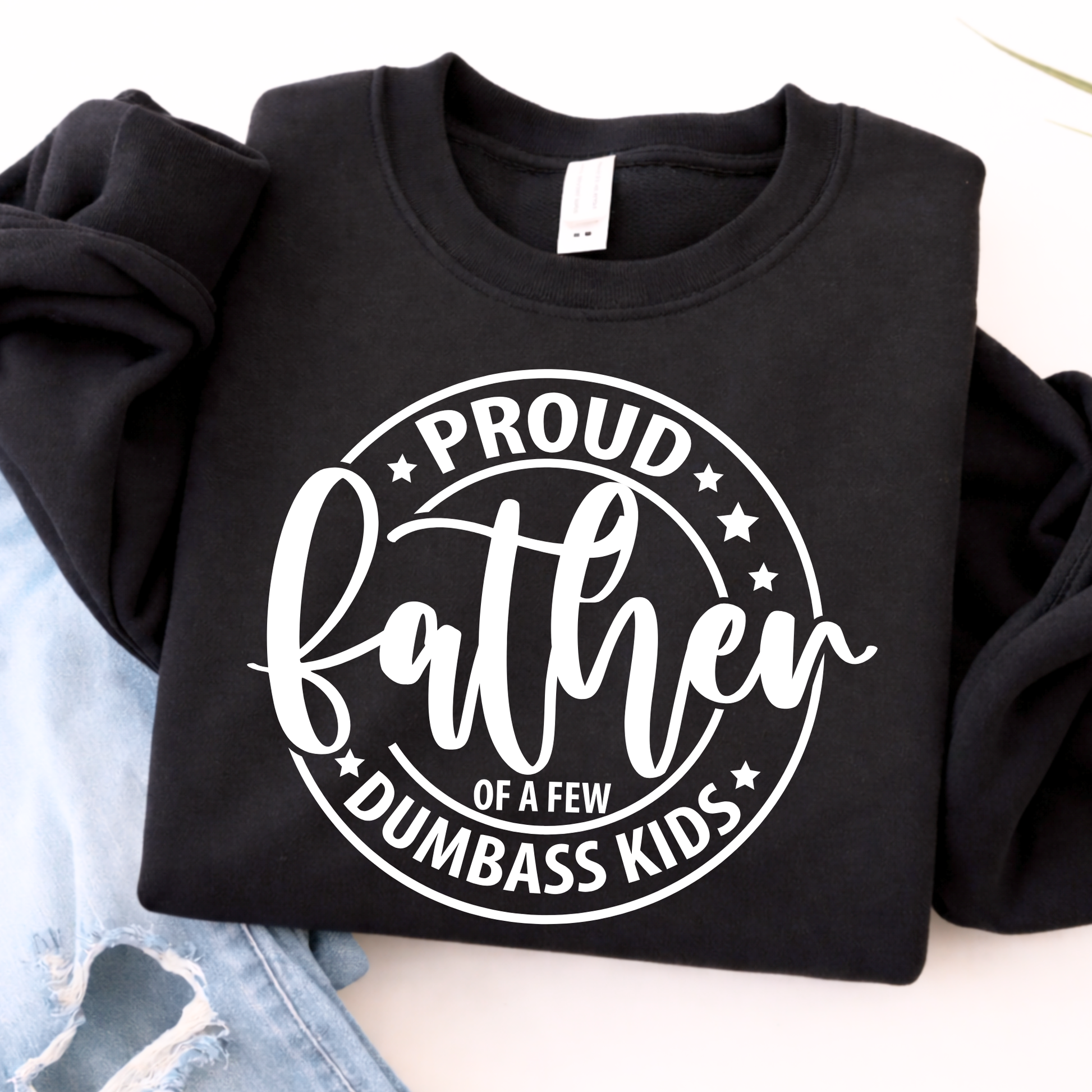 Black sweatshirt with 'Proud father of a few dumbass kids' text on a white background