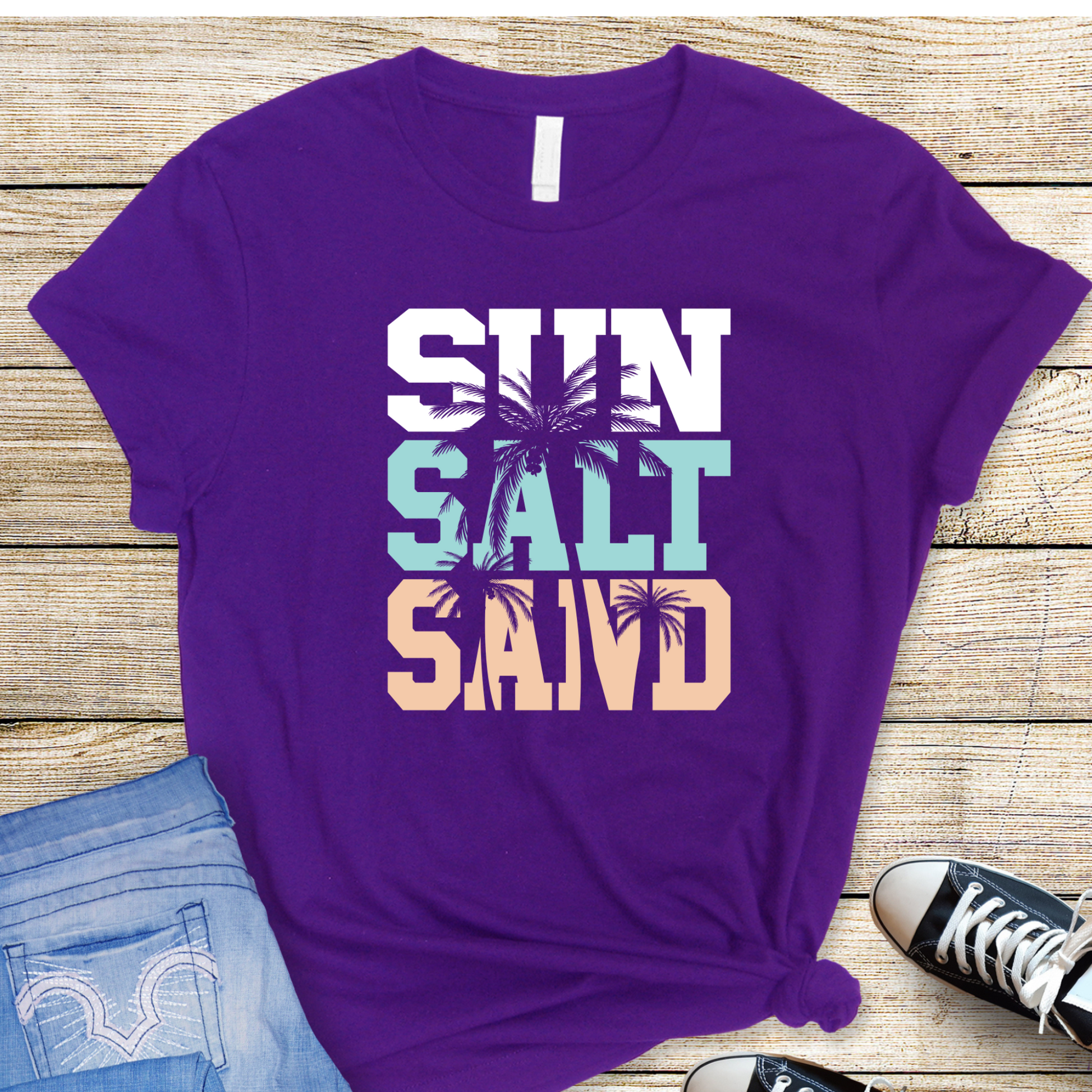 Purple flat lay of beach shirt with pastel print

