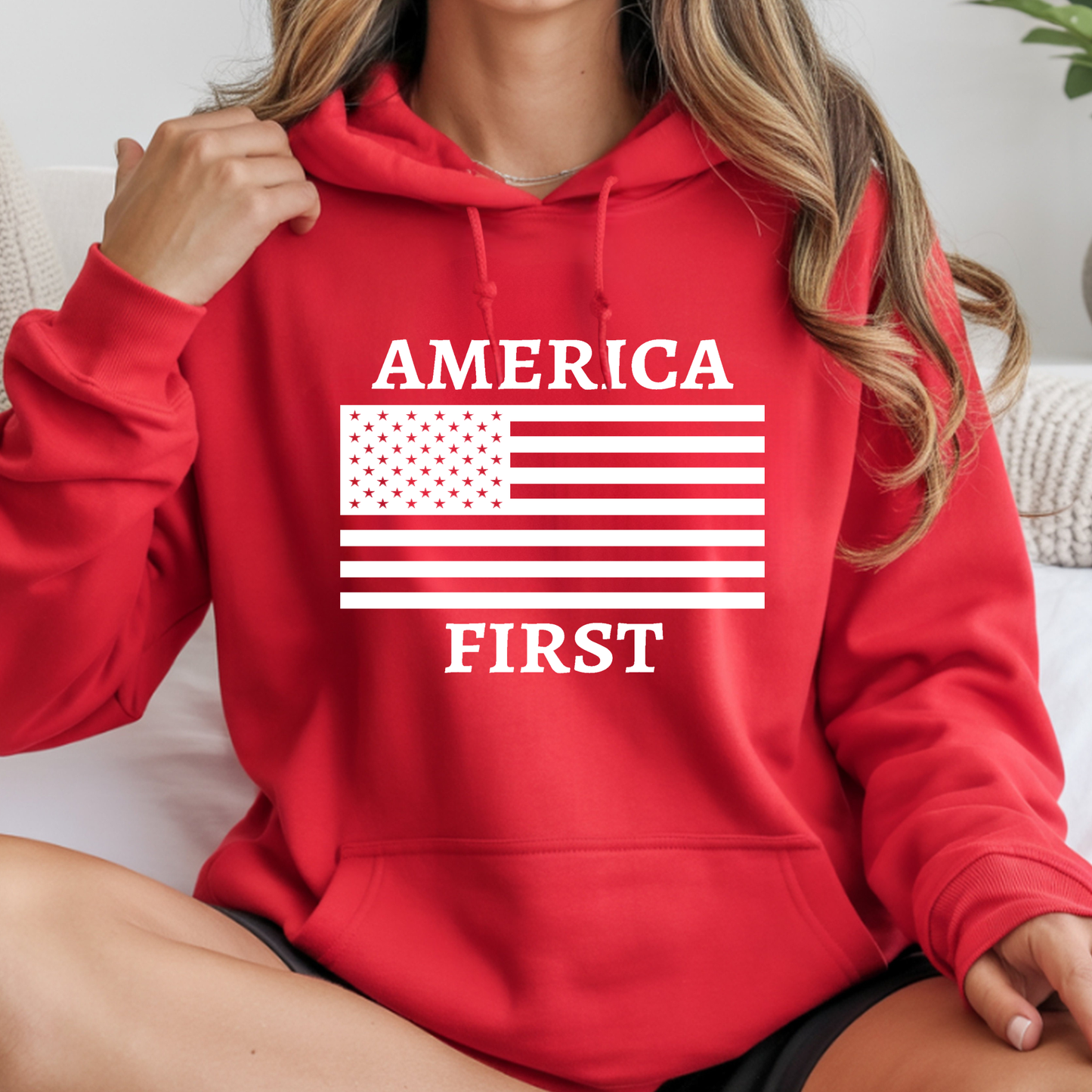 Red America First patriotic women’s unisex hoodie with white American flag design