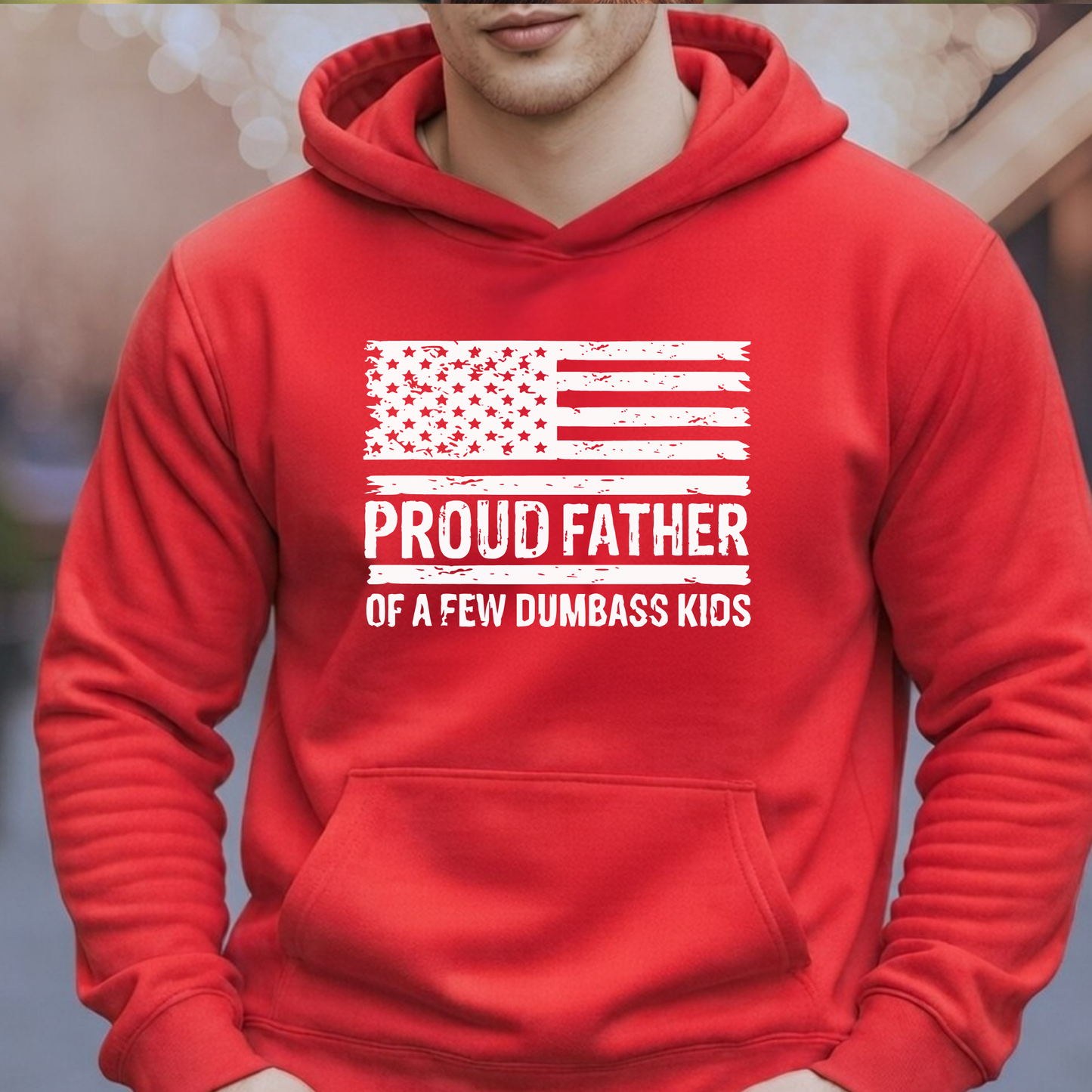 Red hoodie with 'Proud Father of a Few Dumbass Kids' text and American flag design.