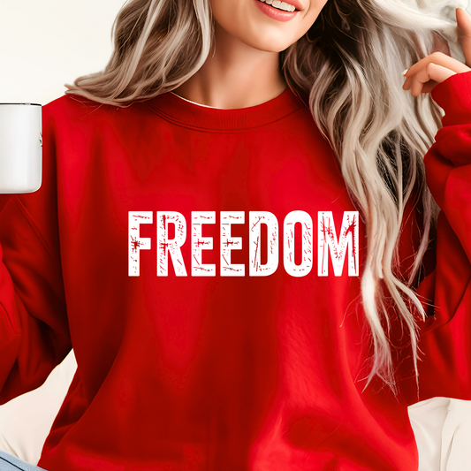 Woman wearing red Charlie Kirk Freedom memorial sweatshirt