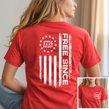 Red t-shirt with white graphic and text worn by a person, with a close-up inset showing the design.