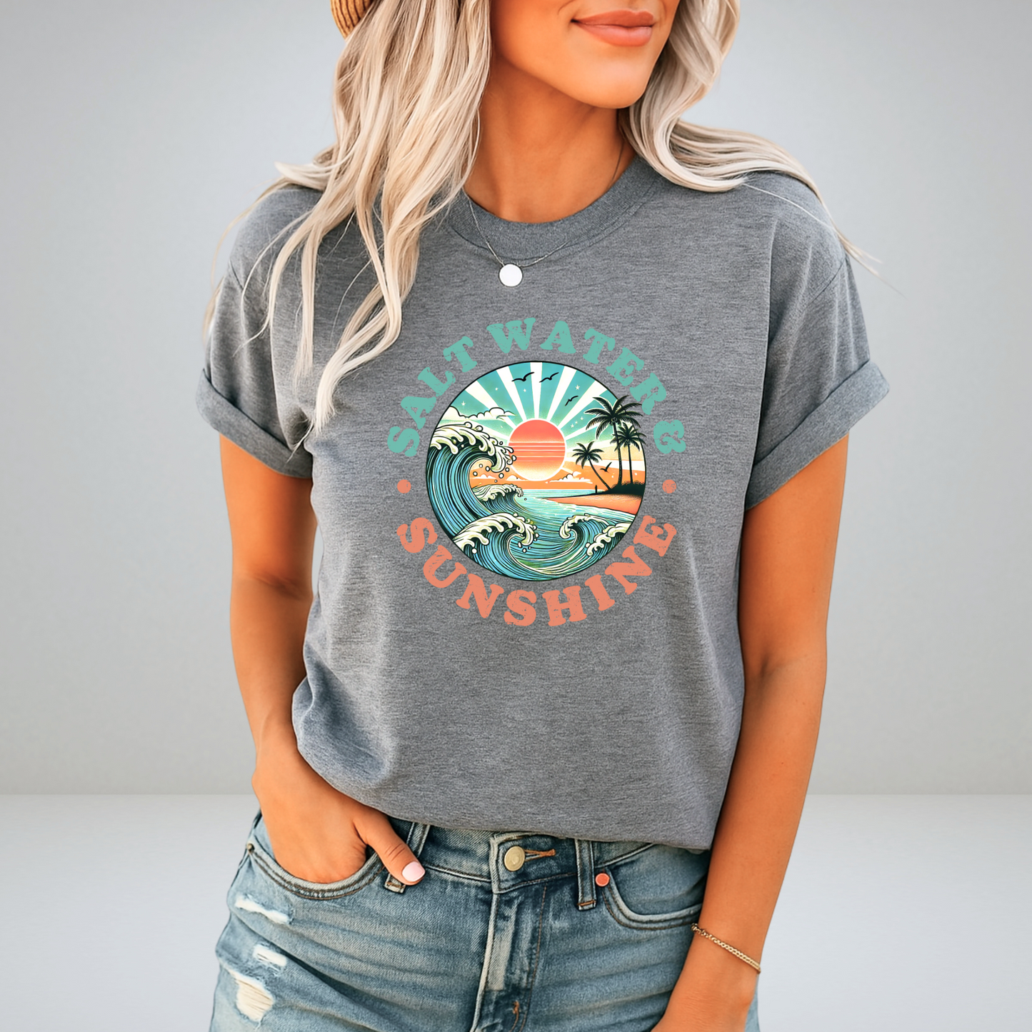 Heather sports gray Salt Water & Sunshine tee styled with denim and a hat

