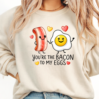 Sand valentine sweatshirt featuring you’re the bacon to my eggs playful bacon and egg love design