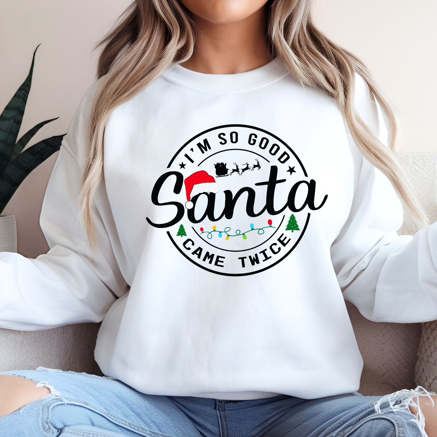 Woman wearing white Christmas sweatshirt – I’m So Good Santa Came Twice design