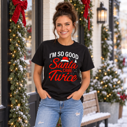 Woman wearing a black T-shirt with the funny I'm So Good Santa Came Twice Christmas design.