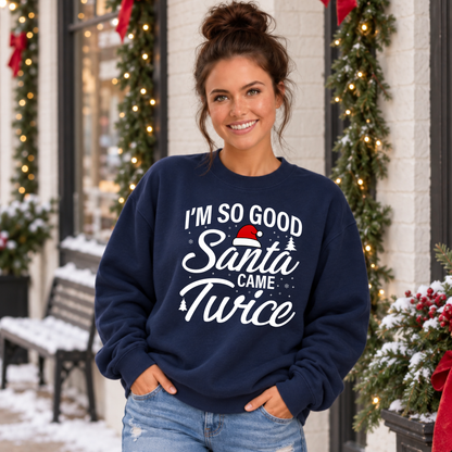 Woman modeling a navy sweatshirt with the I'm So Good Santa Came Twice Christmas graphic.