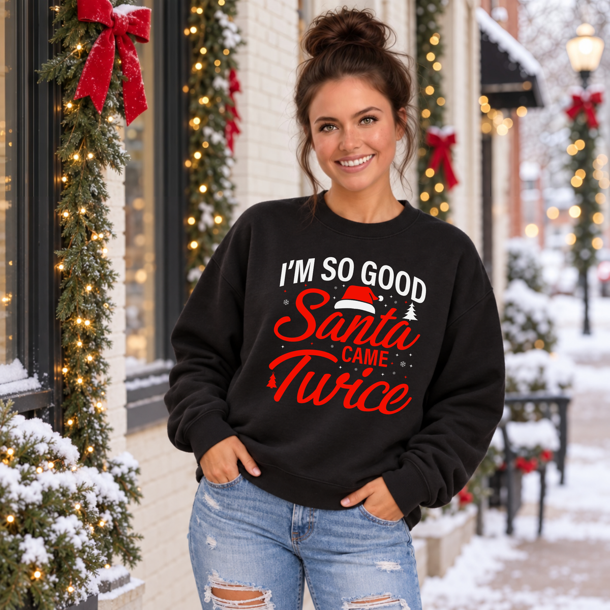 Woman modeling a black crewneck sweatshirt with the Santa Came Twice Christmas graphic.