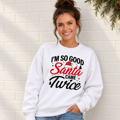 Woman modeling a white sweatshirt with the I'm So Good Santa Came Twice Christmas graphic.