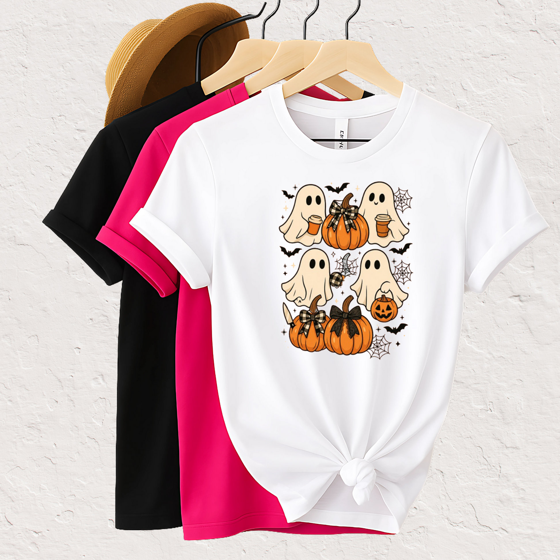 Set of Halloween T-shirts featuring cute ghosts, pumpkins, bats, and cobwebs. Displayed in black, pink, and white colors. Perfect spooky season graphic tees for fall fashion, pumpkin patch trips, or Halloween parties.