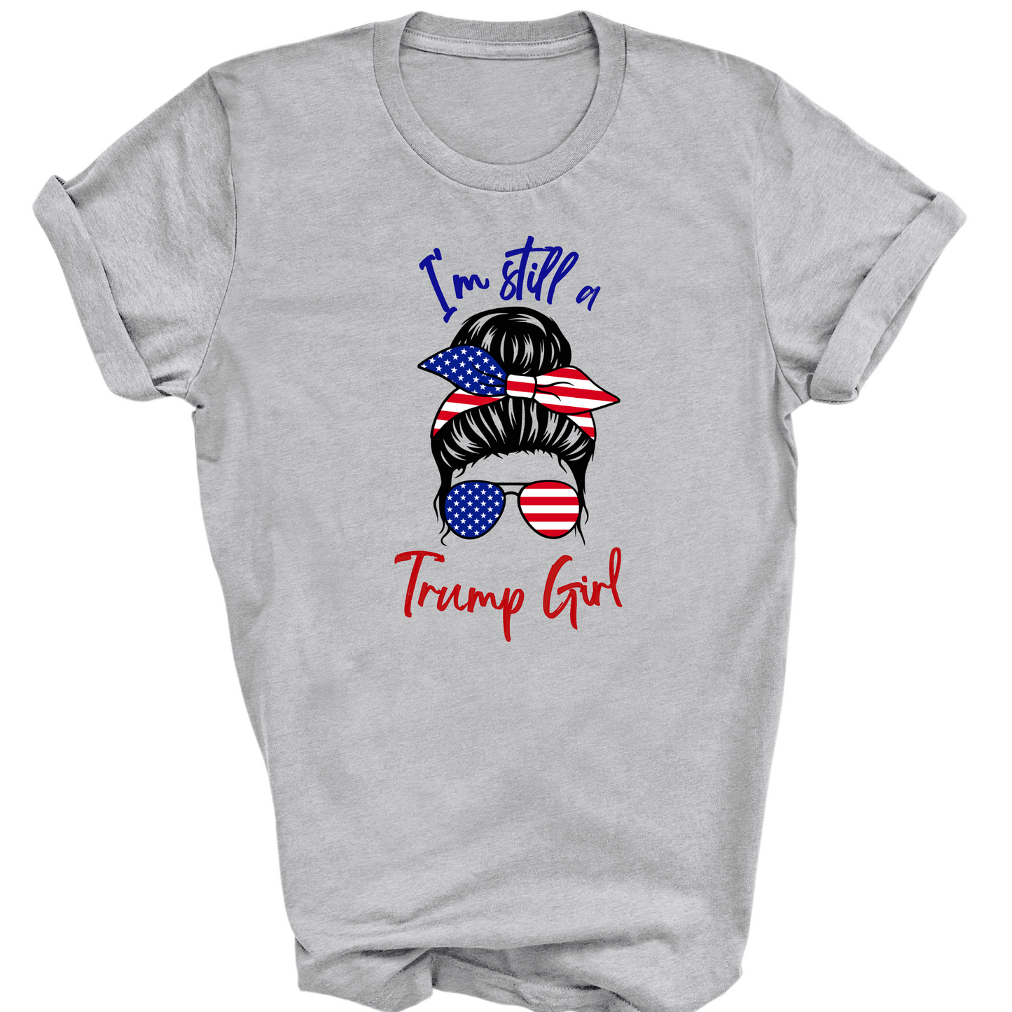 Close-up of Trump Girl graphic tee with red, white, and blue stars-and-stripes bun and patriotic sunglasses.
