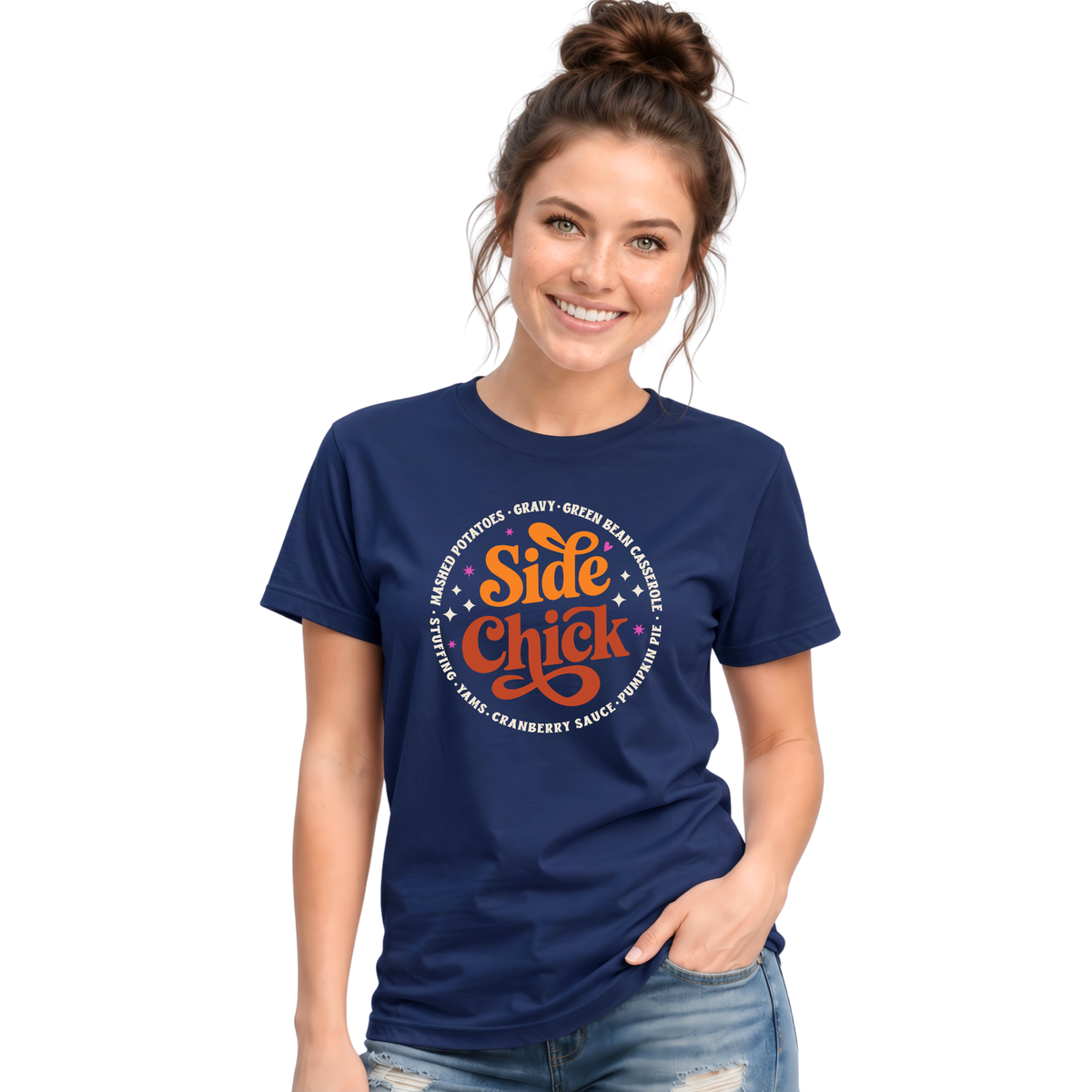 A woman models a Navy T-shirt with the funny retro “Side Chick” Thanksgiving design and light circular side-dish text, paired with light-wash jeans against a white background.