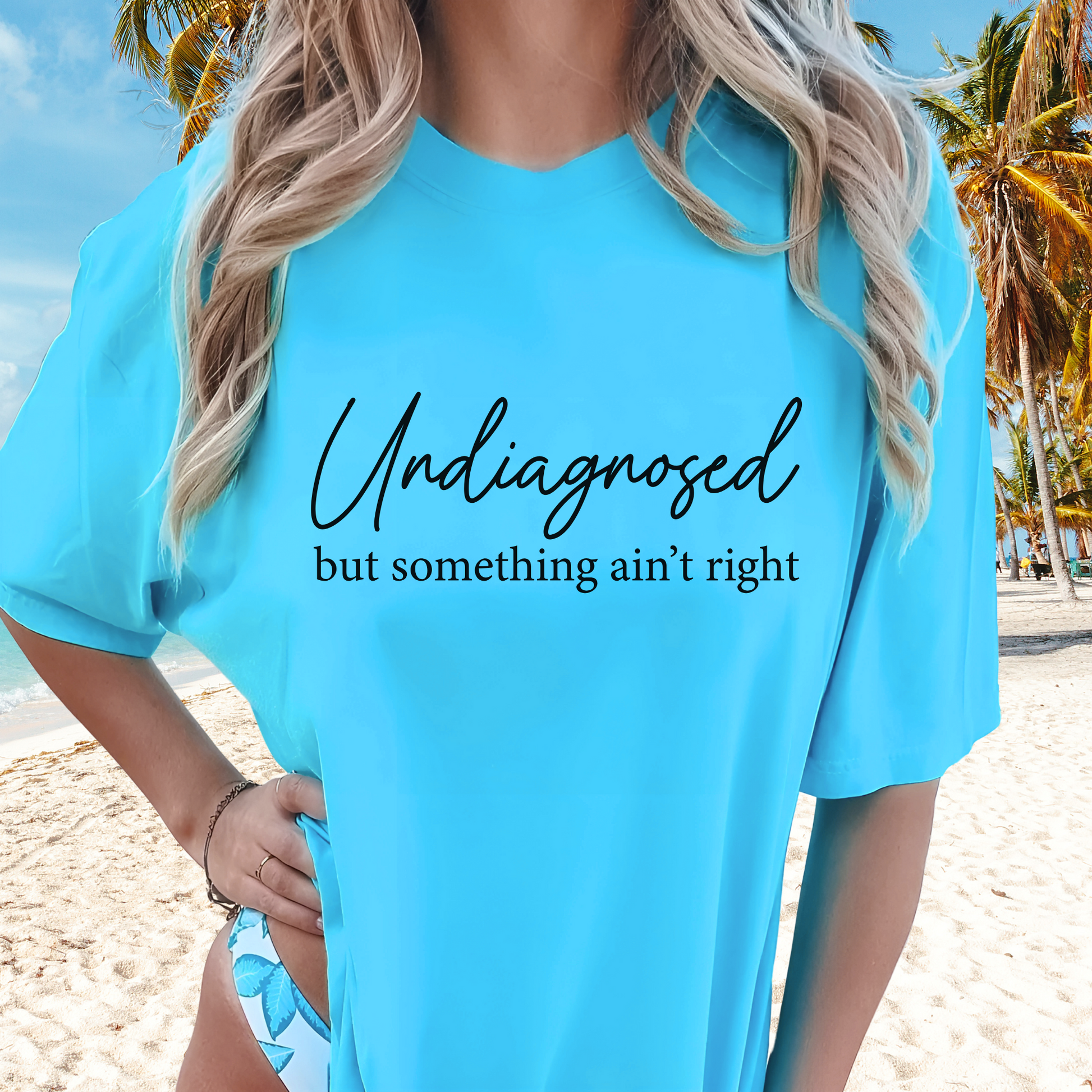 Sky Blue shirt styled with bathing suit, script quote in Black text

