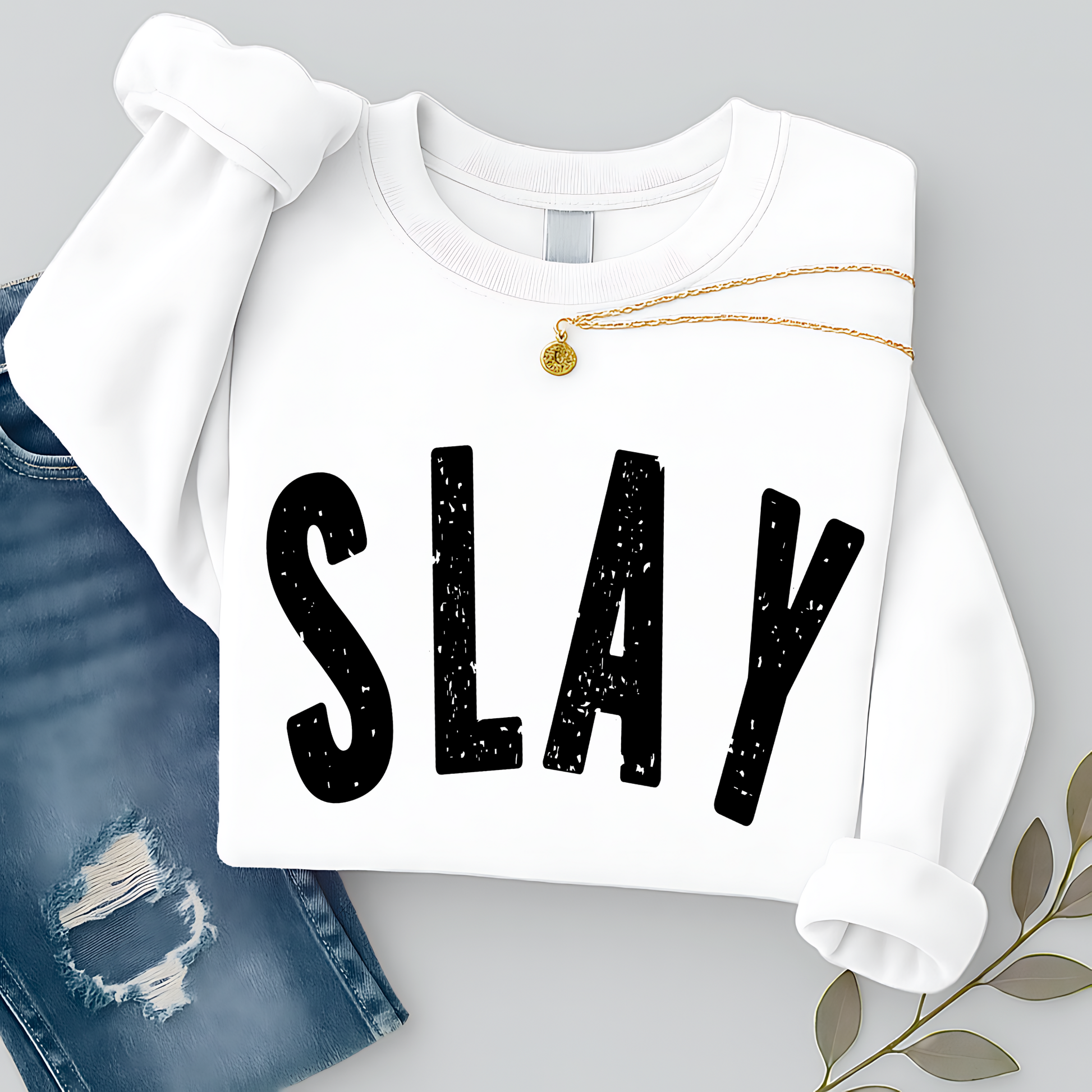 White sweatshirt with 'SLAY' text on a gray background
