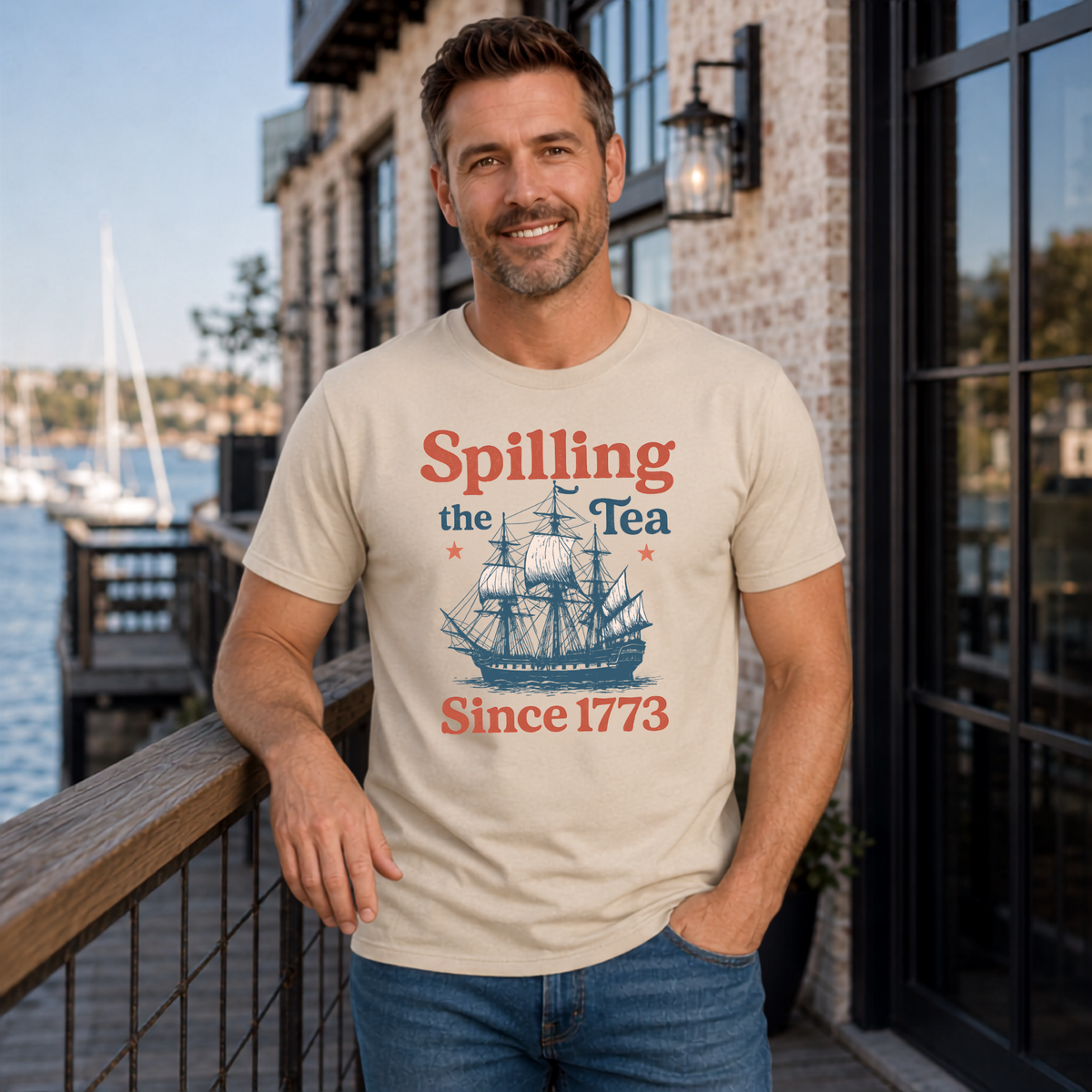 Sand Spilling the Tea Since 1773 men's T-shirt featuring a vintage ship graphic and patriotic history design.