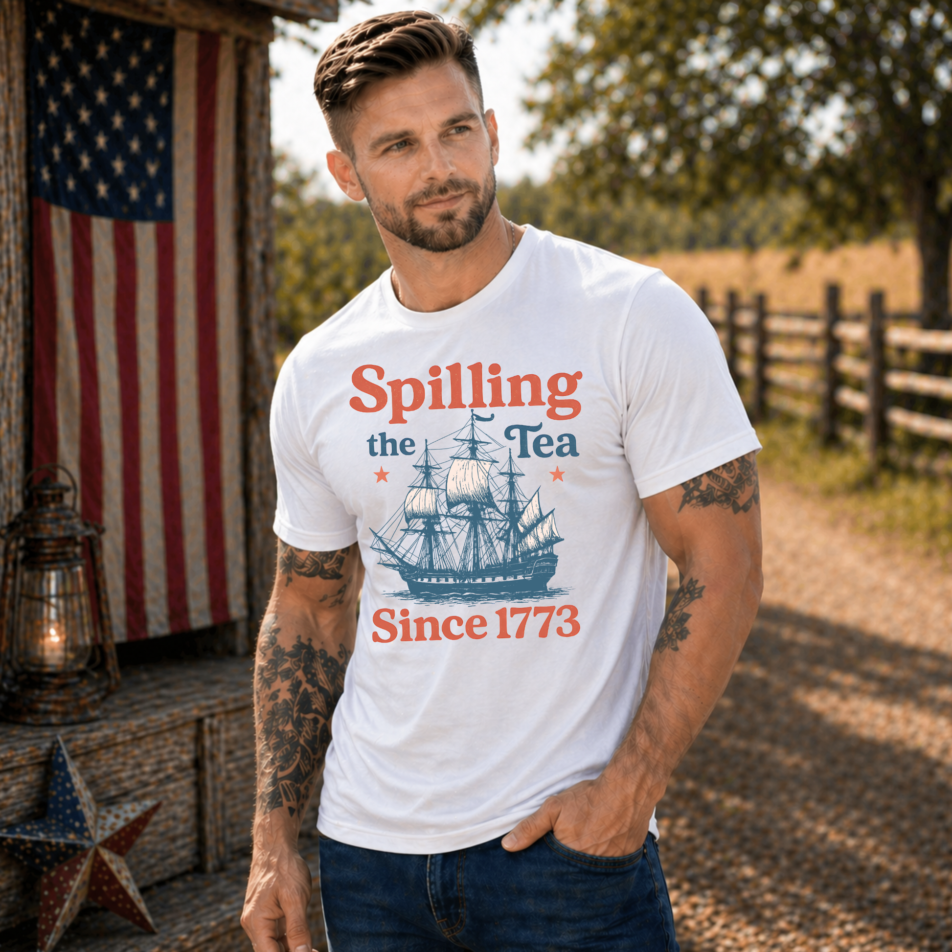 Man wearing a white t-shirt with a ship graphic and text, standing outdoors with an American flag in the background.