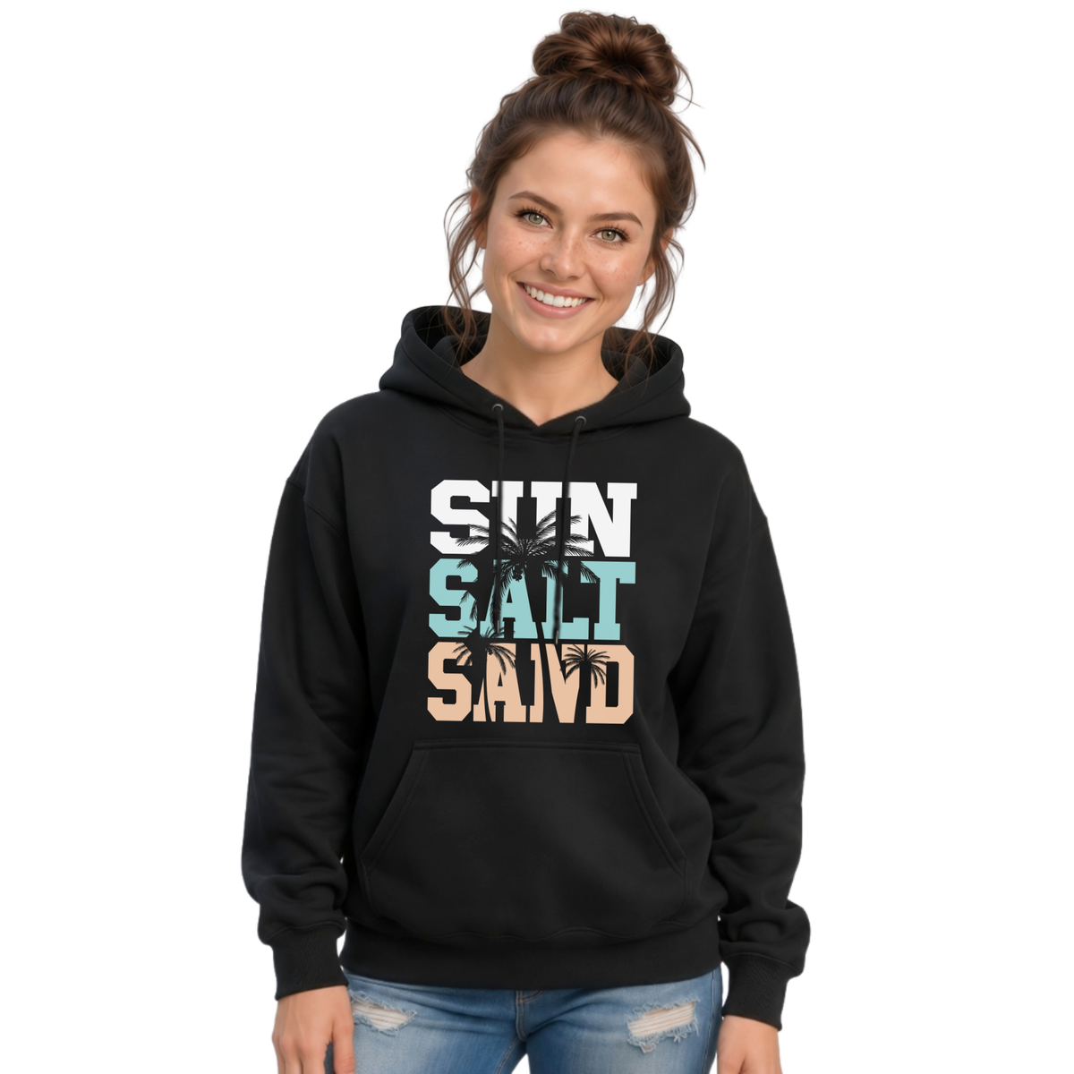 Woman wearing a black pullover hoodie with a stacked Sun Salt Sand graphic in white, aqua, and peach with dark palm trees.