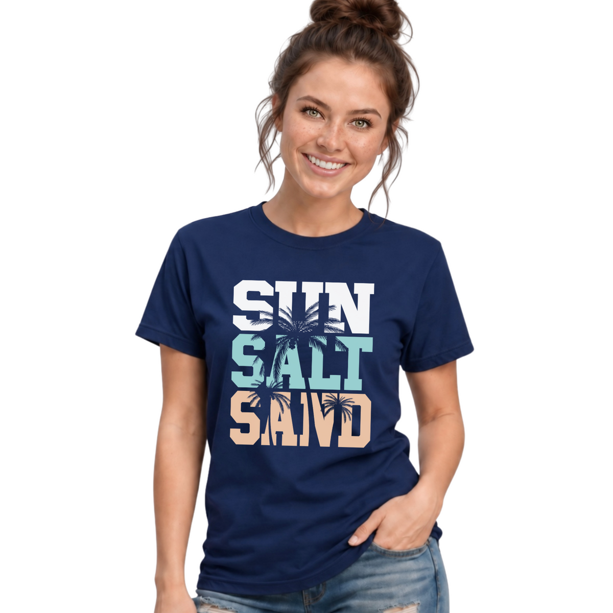 Woman wearing a navy unisex T-shirt with a stacked Sun Salt Sand graphic in white, aqua, and peach with dark palm trees.