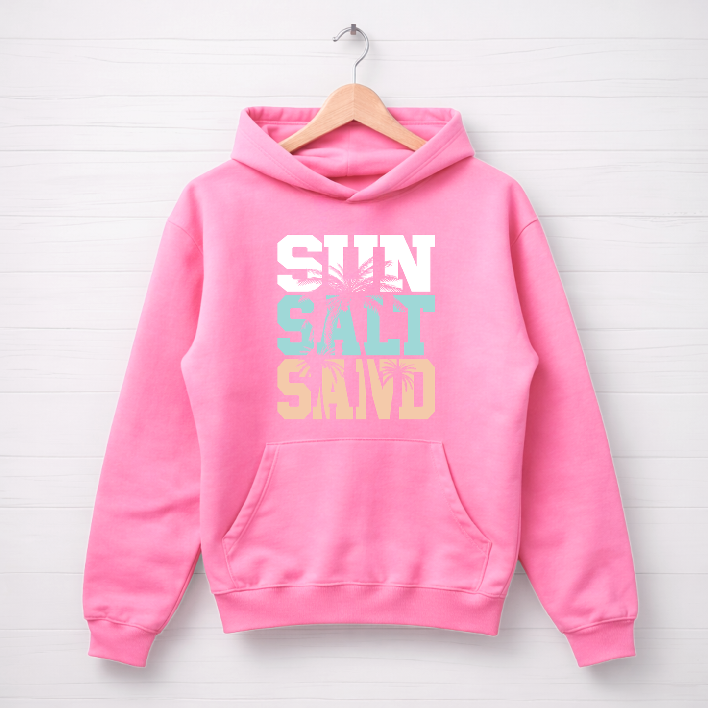 Pink hoodie with 'SUN SALT SAND' text on a white background