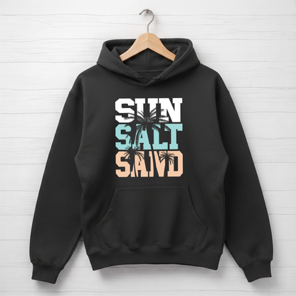 Black hoodie with 'Sun Salt Sand' text and palm trees on a white wooden background