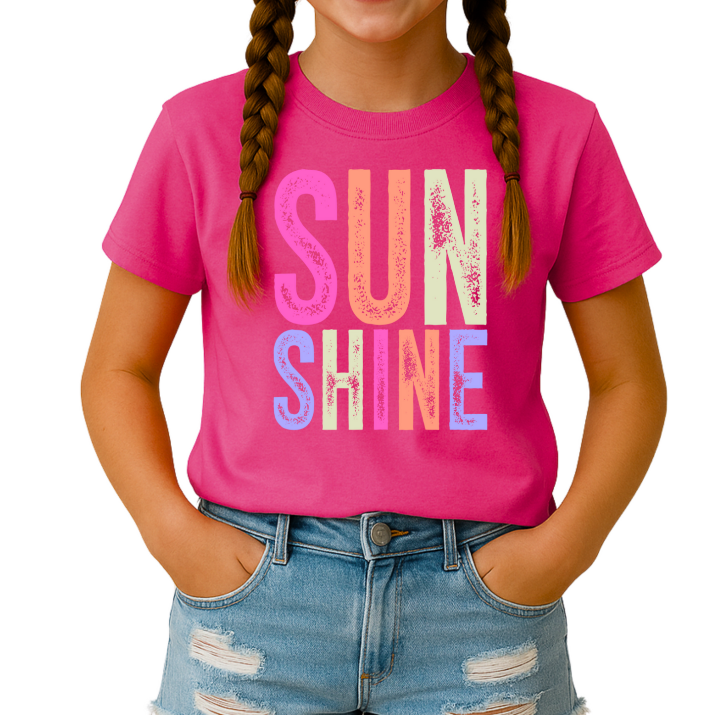 Girl in hot pink “Sunshine” tee and denim shorts, smiling

