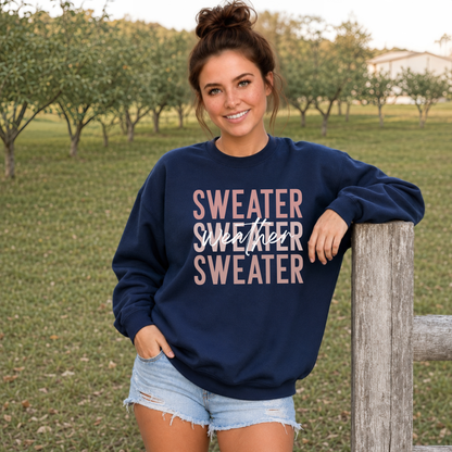 Woman outdoors wearing a navy blue “Sweater Weather Sweater” crewneck sweatshirt with jeans.