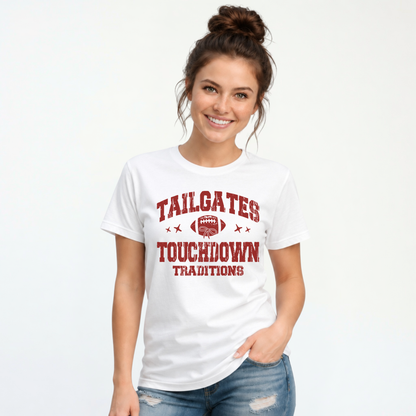 Smiling woman models a white T-shirt with the red Tailgates & Touchdown Traditions football design against a clean studio background.
