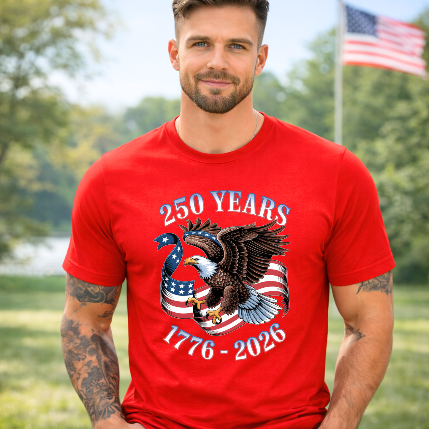 Man wearing a red America 250  t-shirt with an eagle and American flag design, standing outdoors.