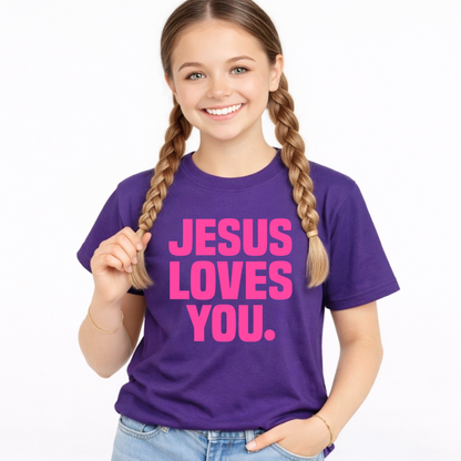 Young girl wearing a purple t-shirt with 'Jesus Loves You' in pink text on a white background