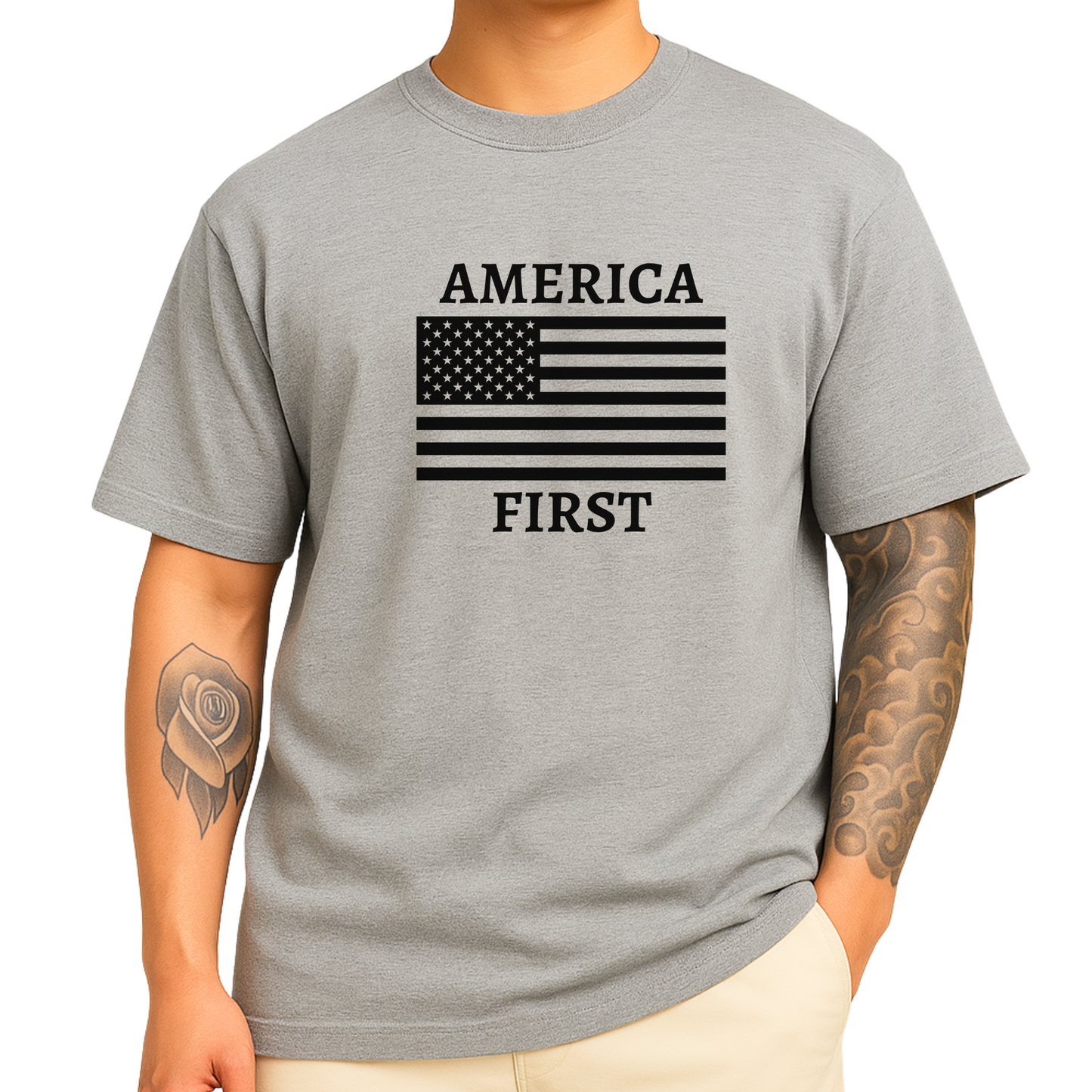 Tattooed man wearing heather gray America First t-shirt with black American flag design
