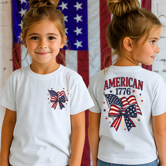 Teen girl in white USA flag tee, smiling with stars and stripes background.
