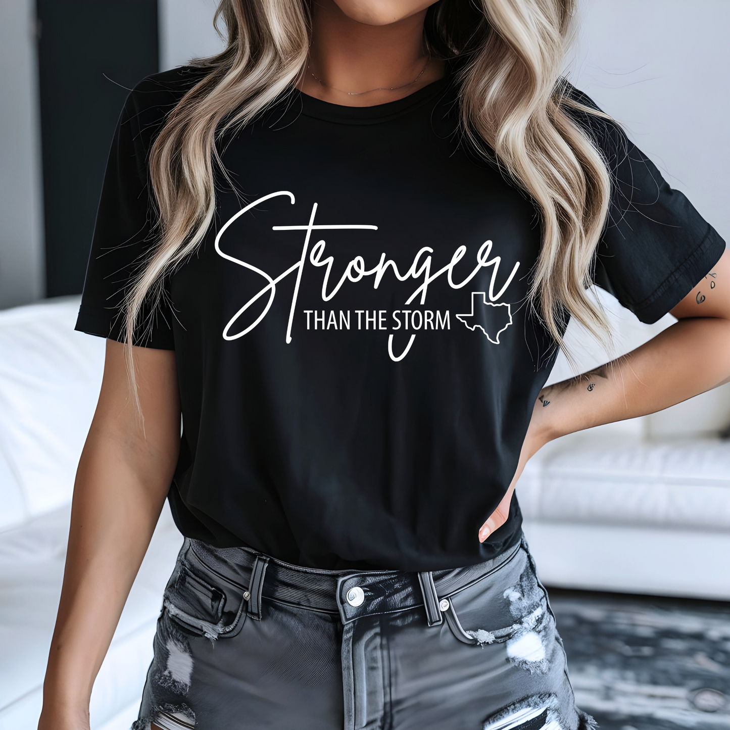 Black "Stronger Than the Storm" unisex Texas support T-shirt with white lettering, storm survivor graphic tee, casual streetwear style.