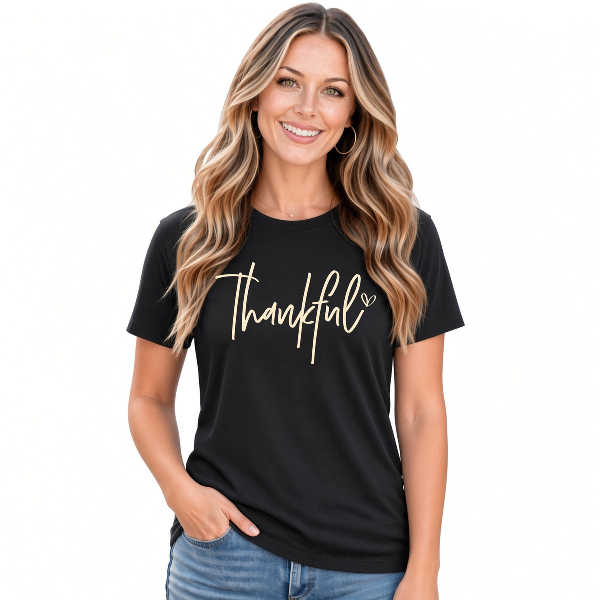 Woman modeling a black T-shirt with a white Thankful script design on a white background