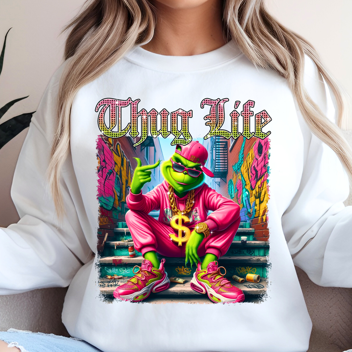 White sweatshirt featuring Thug Life street graphic with vibrant neon colors and urban scene.