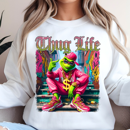 White sweatshirt featuring Thug Life street graphic with vibrant neon colors and urban scene.