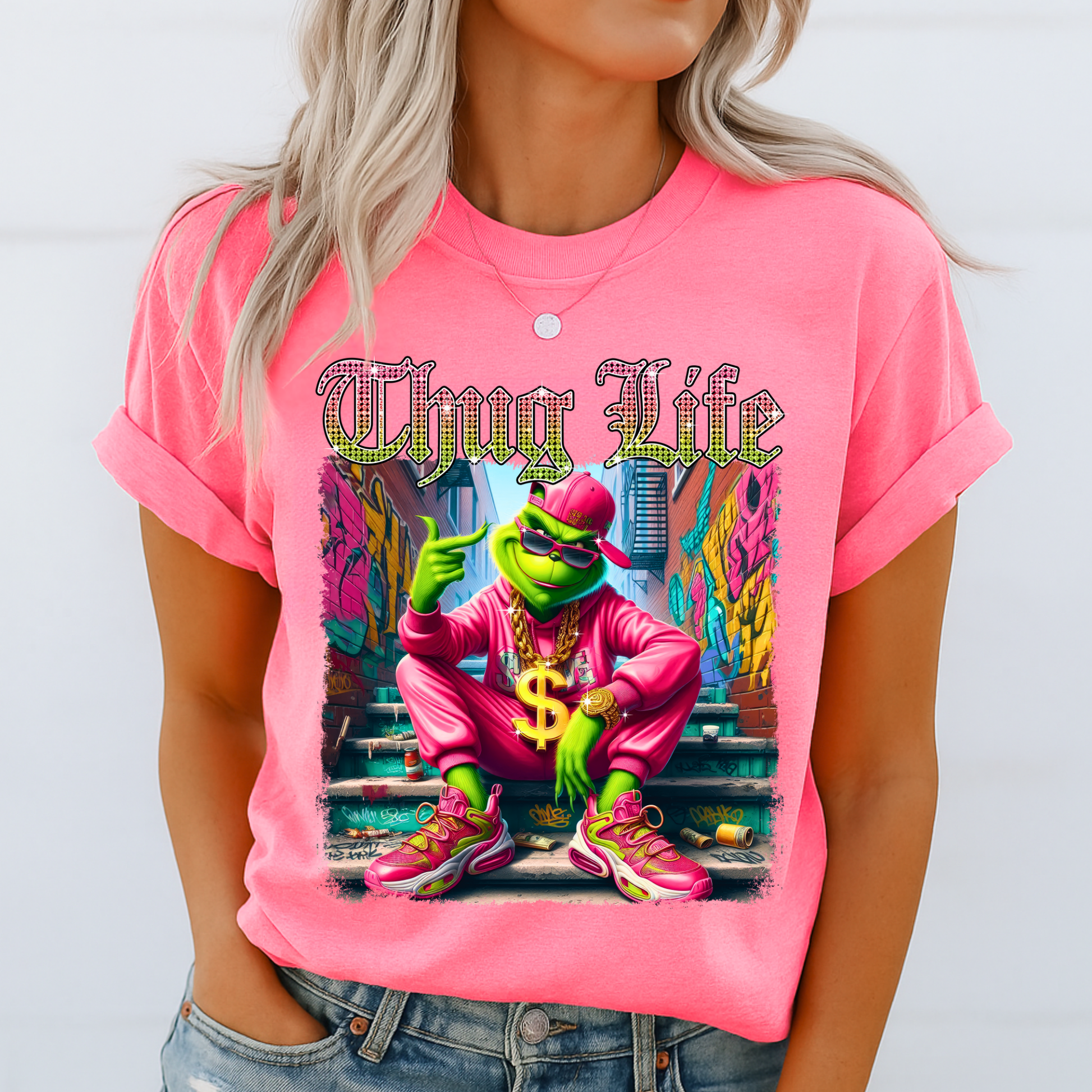 Bright pink unisex t-shirt with bold Thug Life street art graphic, colorful character design, casual outfit photo.