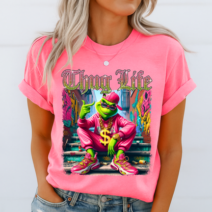 Bright pink unisex t-shirt with bold Thug Life street art graphic, colorful character design, casual outfit photo.