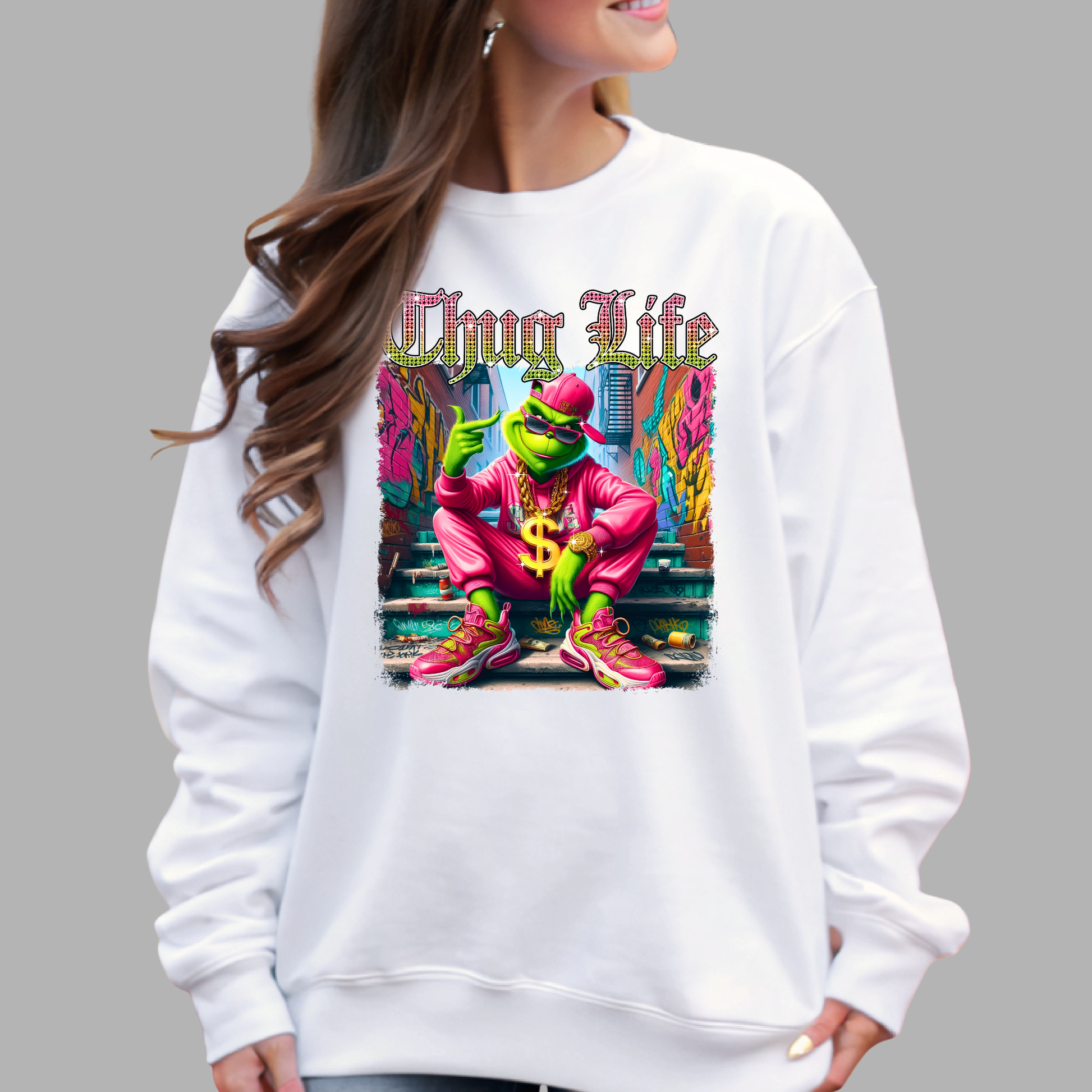 White unisex sweatshirt with bright street style Thug Life graphic featuring a green character in a colorful outfit, urban graffiti background.