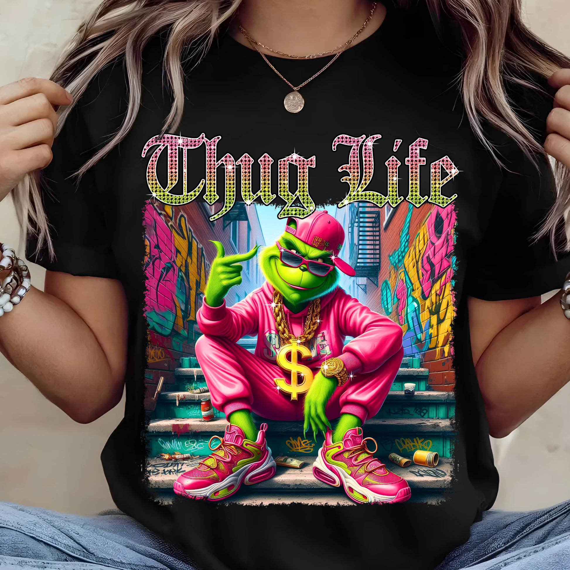 Black oversized t-shirt with bright Thug Life graphic, street art background, colorful detailed print.