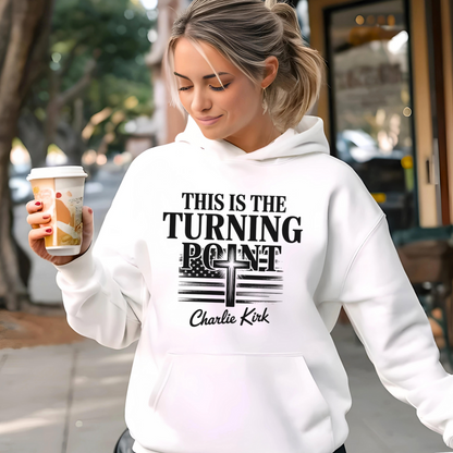 Lifestyle photo of woman wearing white hoodie with Christian patriotic Turning Point cross design outdoors