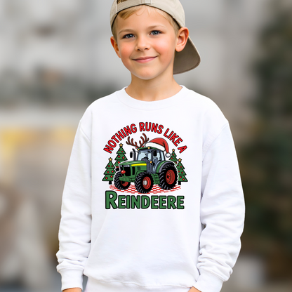 Child wearing a white sweatshirt with a Christmas-themed design featuring a tractor and reindeer.