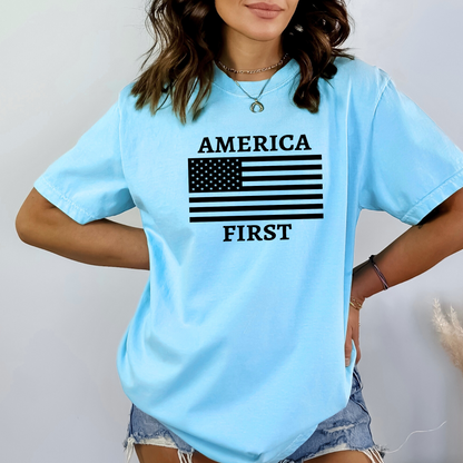 Woman wearing light blue “America First” shirt with black American flag design
